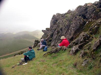Lunch behind the rock wall, sheltered from the gusts.