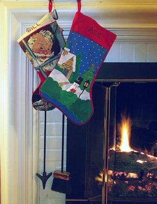 Christmas stockings by fire.