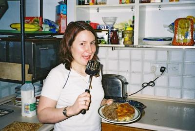 In the kitchen on her day off??  She must be mad, but it entitles her to eat the spatula.