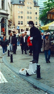 A mime on a street near La Grand Place.