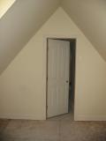 From the attic area, a door to the garage bath