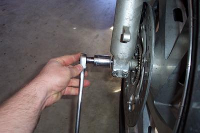 Removing the axle bolt.