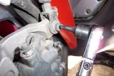 You need a torx bit to remove the upper bolt on the left brake caliper