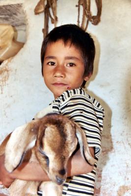 Holding Baby Goat, Siruwari Balami Gau