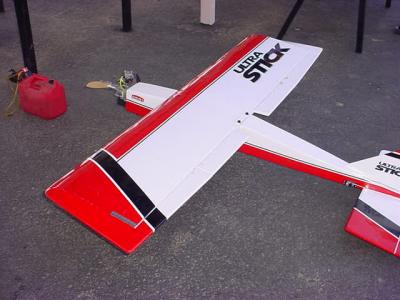 a flying balsa stick airplane with 2 cycle motor
