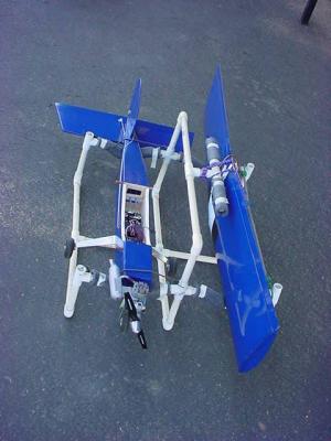 pvc pipe rack holding airplane with 2 cycle motor