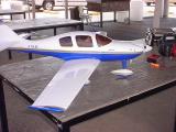 model airplane blue and white in color with a 2 cycle motor