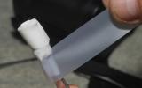Wet: Tape the top of the cloth around the tweezers to hold it in place.