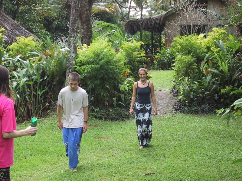 Mark and Jess on the path to our bures (huts) at Maravu Resort (insect repellent is a good idea)