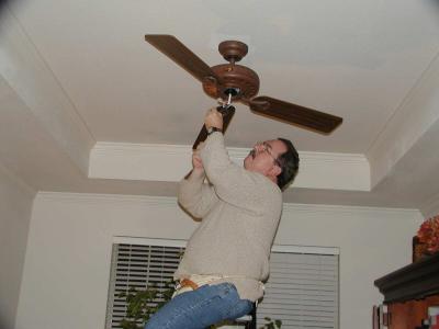 Dad Installing New Ceiling Fan