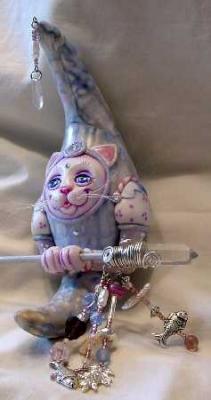 MoonKitty.  She hangs and rattles and is made with a chicken egg.
