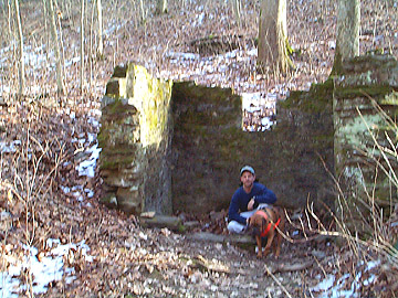 Chris and Biscuit posing in the old spring house ruins