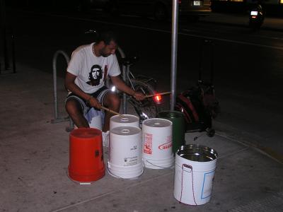 Man playing buckets on Duvall St.JPG