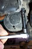 Simply unbolt it with a 8mm socket