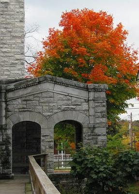 Autumn tree and stone building