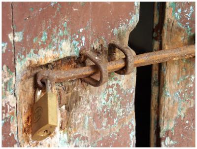 door of a long deserted school building, locked.