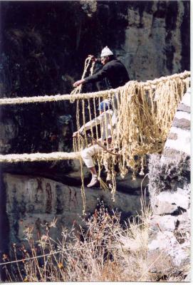 A multitude of small rope strings are laced from the handrail cables tothe outside floor, forming the sidewalls to the bridge