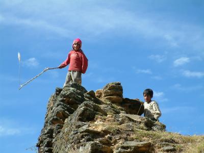 Piruro children playing with a sling