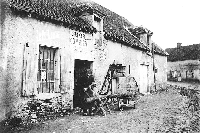 OLD PHOTO 2.  Man with bow saw