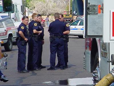 75. 5 policeman 5 firetrucks and police car