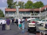 56. hook an ladder, fire equipment, bystanders and golfcart looking north