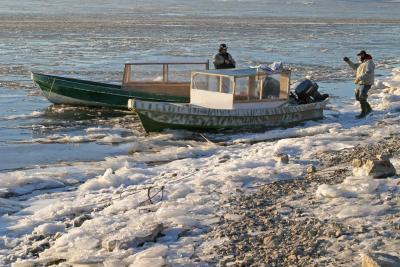 Taxis waiting at shoreline at Moosonee