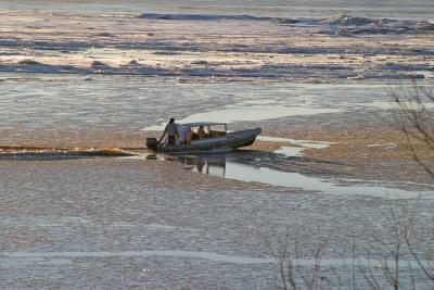 Boat taxi cutting through morning ice November 22, 2004