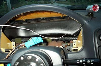 Using a wire clothes hanger, I fed the Tach wire (white) behind the dash.