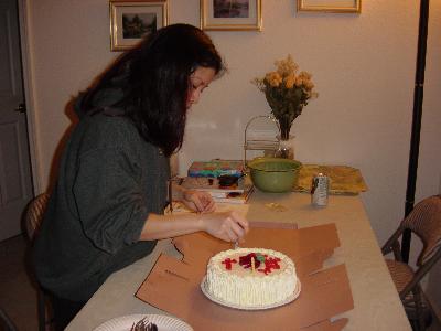 Lynn puts candles on her cake