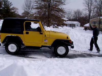 The grateful owner of the snowplow is humbled before the 4-wheel-drive prowess of the Jeep