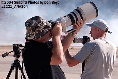 Photog with Canon 400mm f2.8 at the 2004 Aviation Nation Air Show stock photo #2221