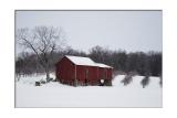 With all that snow, theres not much color except when you can find a nice, red barn!
