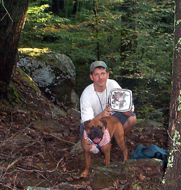 Chris and Biscuit with the cache