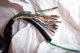 These are the wire ends with the crimped on pins that get inserted in the 34 pin radio connector