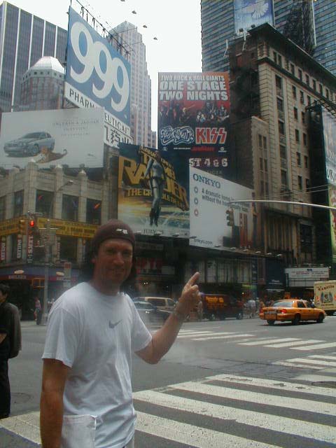 Tommy pointing at the Advertisement for the big show with Aerosmith in Times Square.jpg