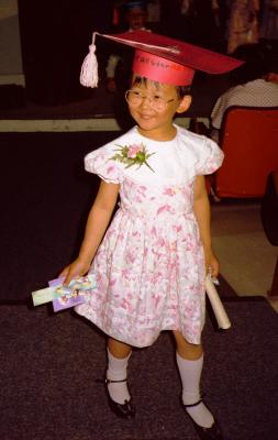 Caroline graduating from kindergarten, 1989