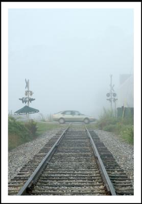 Foggy railroad detail is...