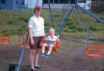 My mother and I at a swingset in Hull Village near Darcy's bar