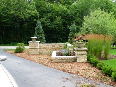 entry wall with light and planter area