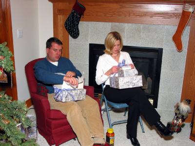 Greg and Rachel opening their presents