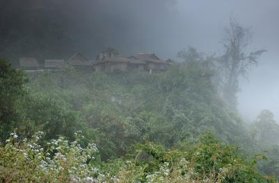Village in the mist on Route 13, Laos