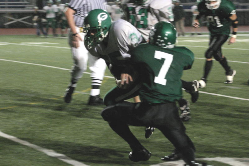 Tony Bartholomew tackling the ball carrier
