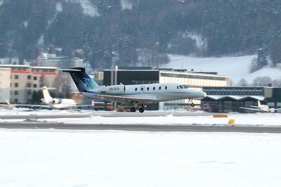 OE-GLS Tyrolean Jet Service, Background left Bombardier BD-700 OY-MSI