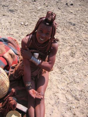Showing us the ochre the Himba use on their skin and hair