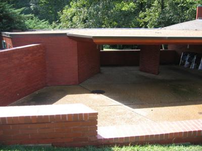 Carport.  Small structure on left is the tool room.  It has a skylight, sink and gorgeous built in cabinets and wall shelves.