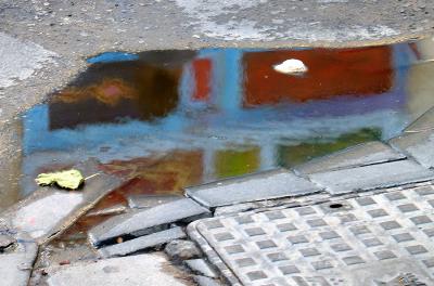 Painted wall - water reflection on the street