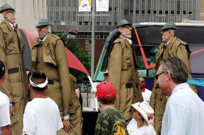 giant men in trenchcoats
