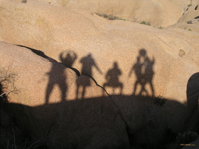 Shadowy Figures At Sunset