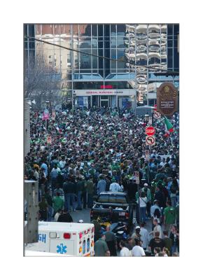 The young put their minds elsewhere as beer flows on the Saturday before St. Patrick's Day in Market Square.