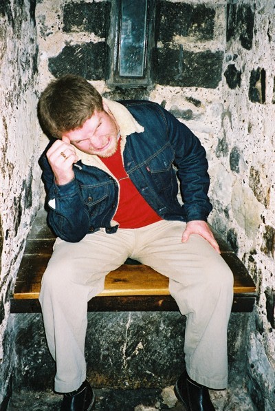 Clint having a hard time on the loo in one of the castles there.  The poop chute leads out down the side of the castle. Nice.